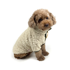 Sherpa Fleece Dog Jacket in Cream/Olive on Model Sitting by Fetch Shops
